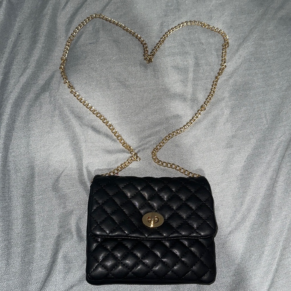 Cute black puffy faux leather crossbody bag. Used.